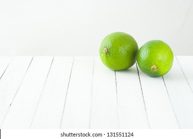 Limes On White Table