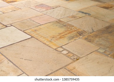 Lime-sandstone slabs laid irregularly on the terrace