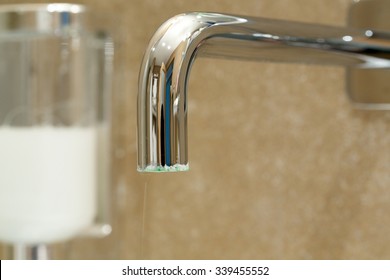 Limescale on a tap in a bathroom.Close up
