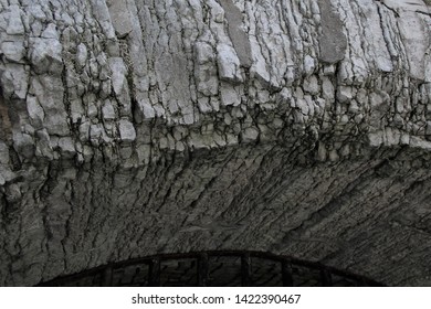 Limestone Arch With Rustic Metal Bars