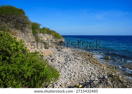 Limestone cliffs overlooking the beach of the Karpata dive site on Bonaire island in the Caribbean Sea