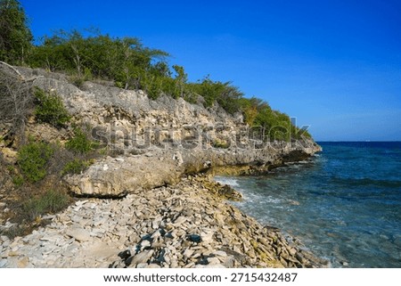 Limestone cliffs overlooking the beach of the Karpata dive site on Bonaire island in the Caribbean Sea