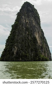 Limestone cliffs rise dramatically above the emerald-green waters.