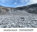 Limestone mining, bench of limestone after blasting.