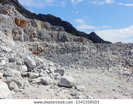 Limestone quarrying for the cement industry in the green forest valley.
