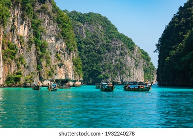 Limestone rocks, clear turquoise water, longtail boats in the Pileh Lagoon, Phi Phi, Thailand. 20.03.2020 