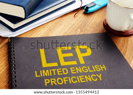 Limited English Proficiency LEP documents on a desk.