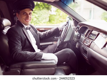 Limousine Driver Smiling At Camera In His Limo