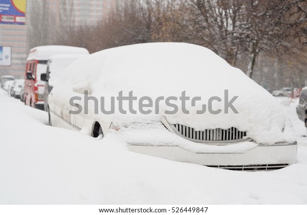Limousine\
parked on a street in snow storm,\
Russia.