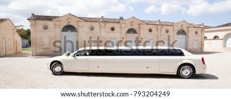 limousine white parked in front of castle in France
