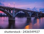 Lincoln Memorial Bridge, adjacent to the George Rogers Clark Memorial, that crosses the Wabash River connecting the towns of Vincennes, Indiana and Westport, Illinois, shown at sunset. 