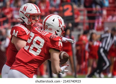 
Lincoln, Nebraska, USA - April 9, 2022: University Of Nebraska Football Freshman Running Back Matthew Schuster Takes The Handoff During The Annual Red-White Spring Game At Memorial Stadium.