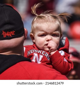 Lincoln, Nebraska, USA - April 9, 2022: A Young University Of Nebraska Football Fan And Her Father At The Annual Red-White Spring Game At Memorial Stadium In Lincoln.