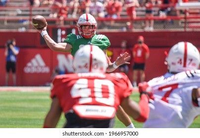 Lincoln, Nebraska, USA - May 1, 2021: University Of Nebraska Football Quarterback Adrian Martinez Throws A Pass In The Annual Red-White Spring Game At Memorial Stadium In Lincoln.