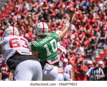 

Lincoln, Nebraska, USA - May 1, 2021: University Of Nebraska Football Quarterback Heinrich Haarberg Throws A Pass In The Annual Red-White Spring Game At Memorial Stadium In Lincoln.