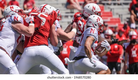 Lincoln, Nebraska, USA - May 1, 2021: Nebraska Football Runningback Isaiah Harris Runs Away Tacklers In The Annual Red-White Spring Game At Memorial Stadium In Lincoln.