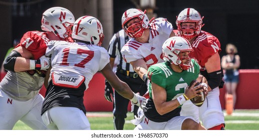 Lincoln, Nebraska, USA - May 1, 2021: Nebraska Football Quarterback Adrian Martinez Runs Away Tacklers In The Annual Red-White Spring Game At Memorial Stadium In Lincoln.