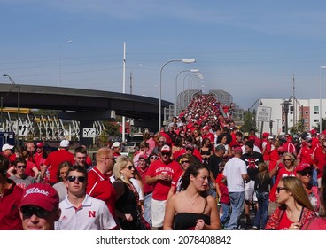 LINCOLN, UNITED STATES - Oct 11, 2021: A Scenic Shot Of Nebraska Cornhuskers Football Fans Crossing The Bridge Into The Stadium