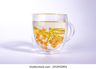 Linden tea in the double wall glass cup.