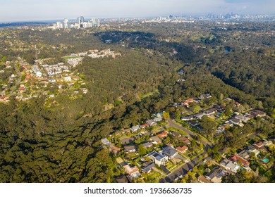 Lindfield, Sydney, Australia - Sept 17 2020: Aerial Shot Of Leafy Suburban Area Surrounded By Bush Parkland, Buildings And Sydney CBD In The Background