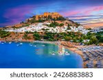 Lindos city on Rhodes island, Greece.  Small whitewashed village and the Acropolis, on Rhodos Island, Greece at Aegean Sea