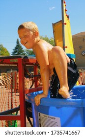 Lindstrom, MN USA September 12, 2010 Boy Getting Out Of A Dunk Tank After Being Dunked.