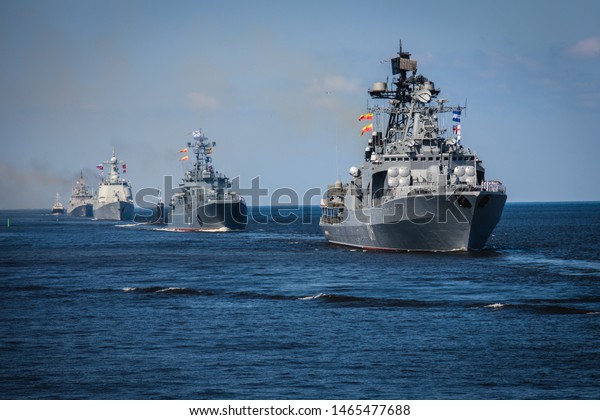 A line ahead of modern russian military naval
battleships warships in the row, northern fleet and baltic sea
fleet, summer sunny day
