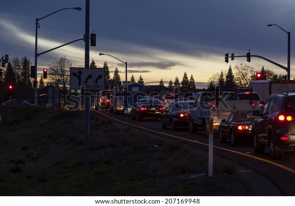 Line of\
Automobiles Stopped At Light\
Twilight