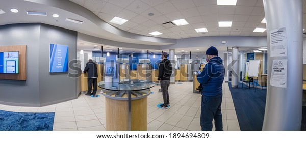 Line in a bank,\
people wearing the mask and waiting in the line, Bronx, New York,\
United States, 1.15.2021 