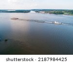 Line barge transiting upstream on the Mississippi River near Vicksburg, MS, USA.