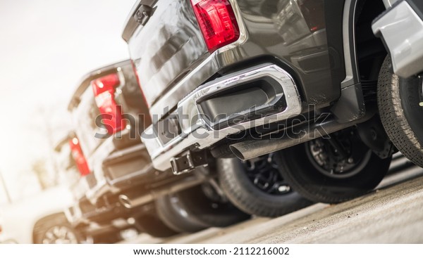 Line of Brand New Pickup Trucks For Sale.\
Commercial Vehicles Dealership. Automotive and Transportation\
Industry Theme.