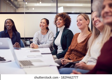 Line Of Businesswomen In Modern Office Listening To Presentation By Colleague - Shutterstock ID 1829462777