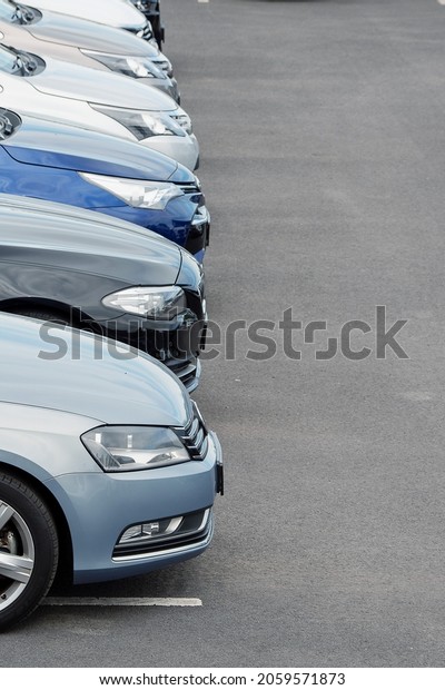 Line of cars in a parking lot. Second hand\
vehicle for sale concept. Busy parking lot at rush hour theme. Free\
parking space in big busy city\
problem