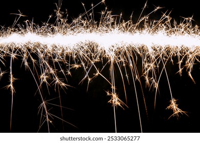 Line of christmas sparklers light trail on black background. - Powered by Shutterstock