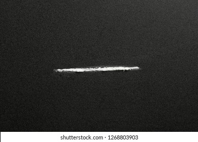 Line of cocaine on dark background, top view