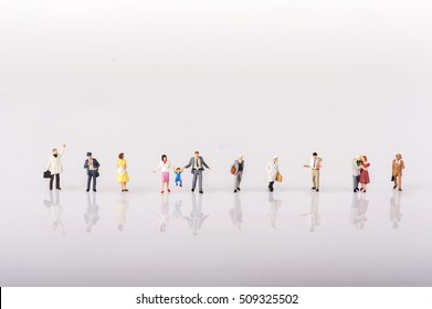 Line Of Diverse Tiny Miniature Model People