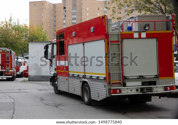 A line of fire
engines.  Fire in the room.  Fire hazard.  Failure to comply with
fire safety regulations