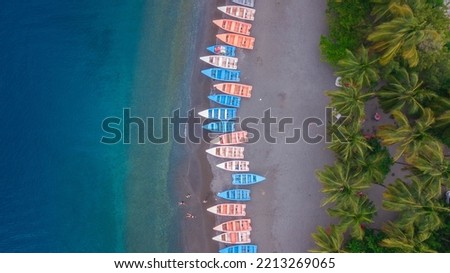 Line up Fisher boats in the beach of the dominican republic