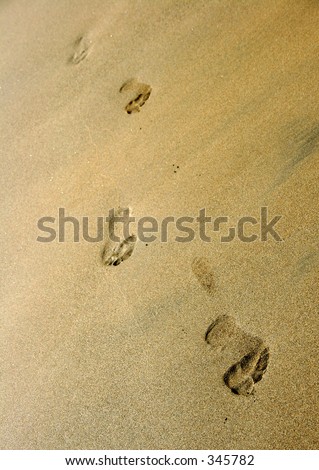 Line of footprints on the beach