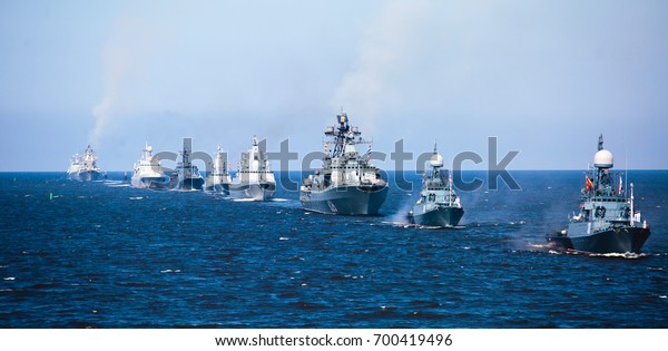 A line of modern russian military naval battleships
warships in the row, northern fleet and baltic sea fleet in the
open sea