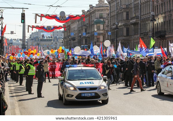 The line of the police\
cordon and police car.\
St. Petersburg, Russia - 1 May, 2016.\
Day\
festive demonstration on the Nevsky Prospect in St. Petersburg, the\
first of May.