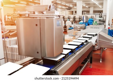 Line For The Production Of Meat With Packaging And Cutting . Industrial Equipment At A Meat Factory. Meat Processing Plant. Production Line Of Meat.