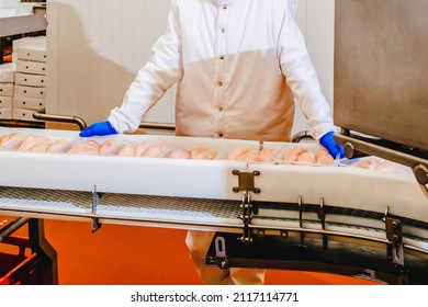 Line For The Production Of Semi-finished Meat Products.Meat Processing In Food Industry.Packing Of Meat Slices In Boxes On A Conveyor Belt.modern Poultry Processing Plant.