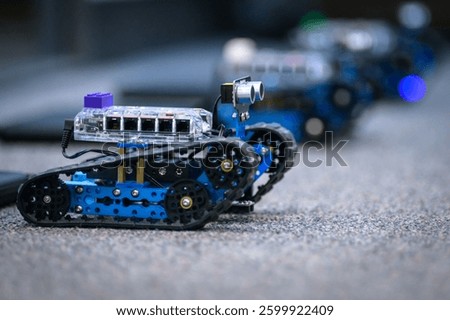 a line of robotic vehicles controlled using coding