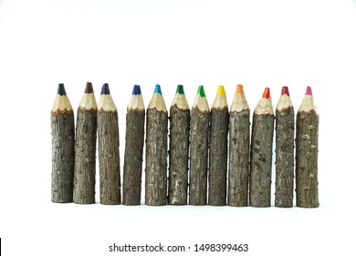 Line of rustic wooden color pencils, with white background - Powered by Shutterstock