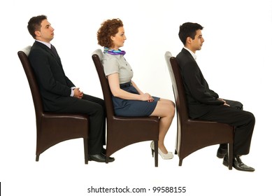 Line Of Three Business People Sitting On Chairs In Profile Isolated On White Background