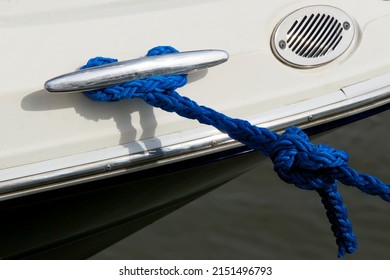 a line tied to the cleat securing the yacht