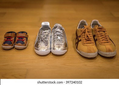 Line Ups Of Three Different Sizes Of Shoes In A Family