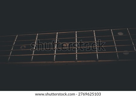 Linear Bronze Echoes Within Dark Atmospheric Fretboard Shadows