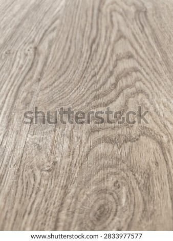 Linear timber board background with expressive focal wood knot detail
